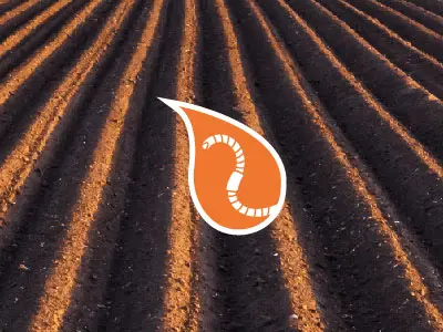 visuel des biostimulants de préparation de sol avec une goutte orange avec un ver de terre dedans